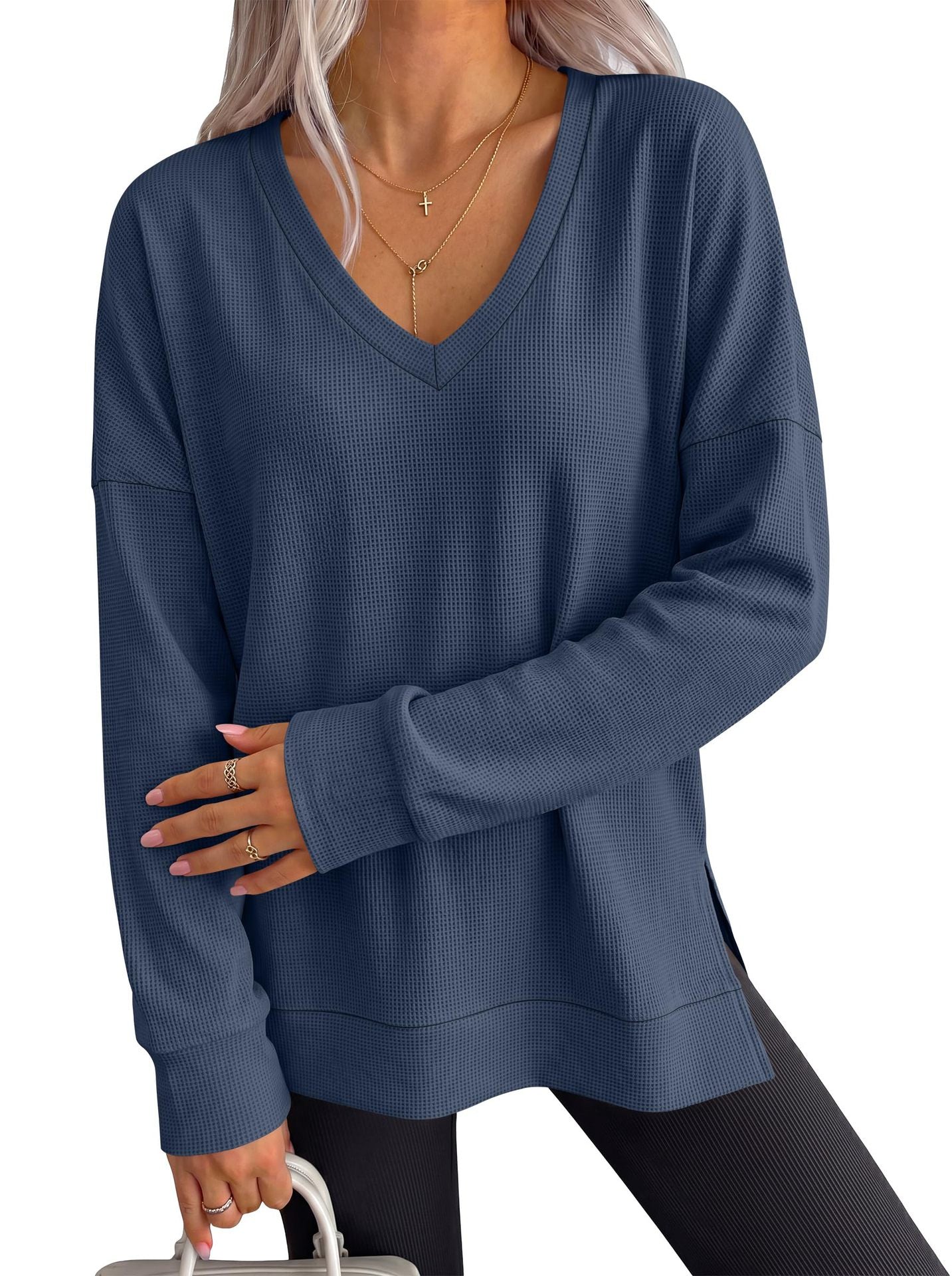 Women’s blue V-neck long-sleeve waffle knit loose T-shirt top, oversized silhouette.