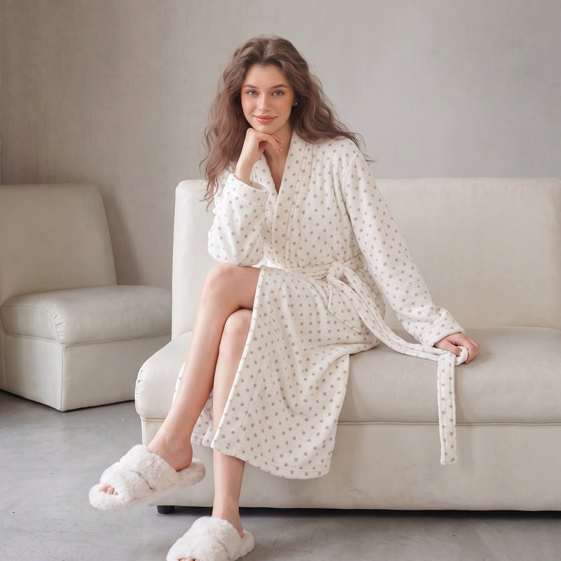 Women’s long flannel bathrobe in white with tiny dotted print, hooded collar and tie belt