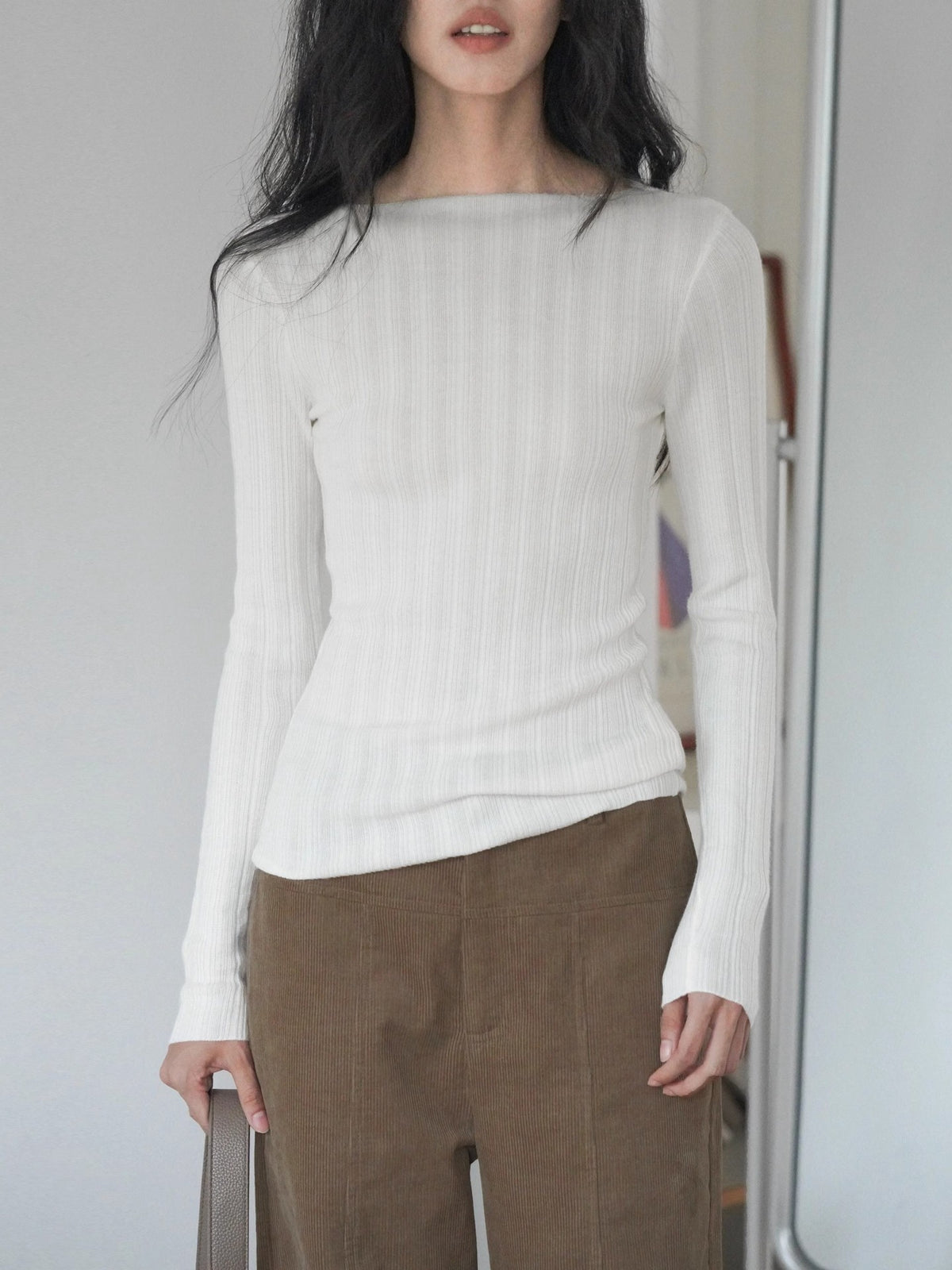 Women's white ribbed knit long-sleeve fitted top with crew neck