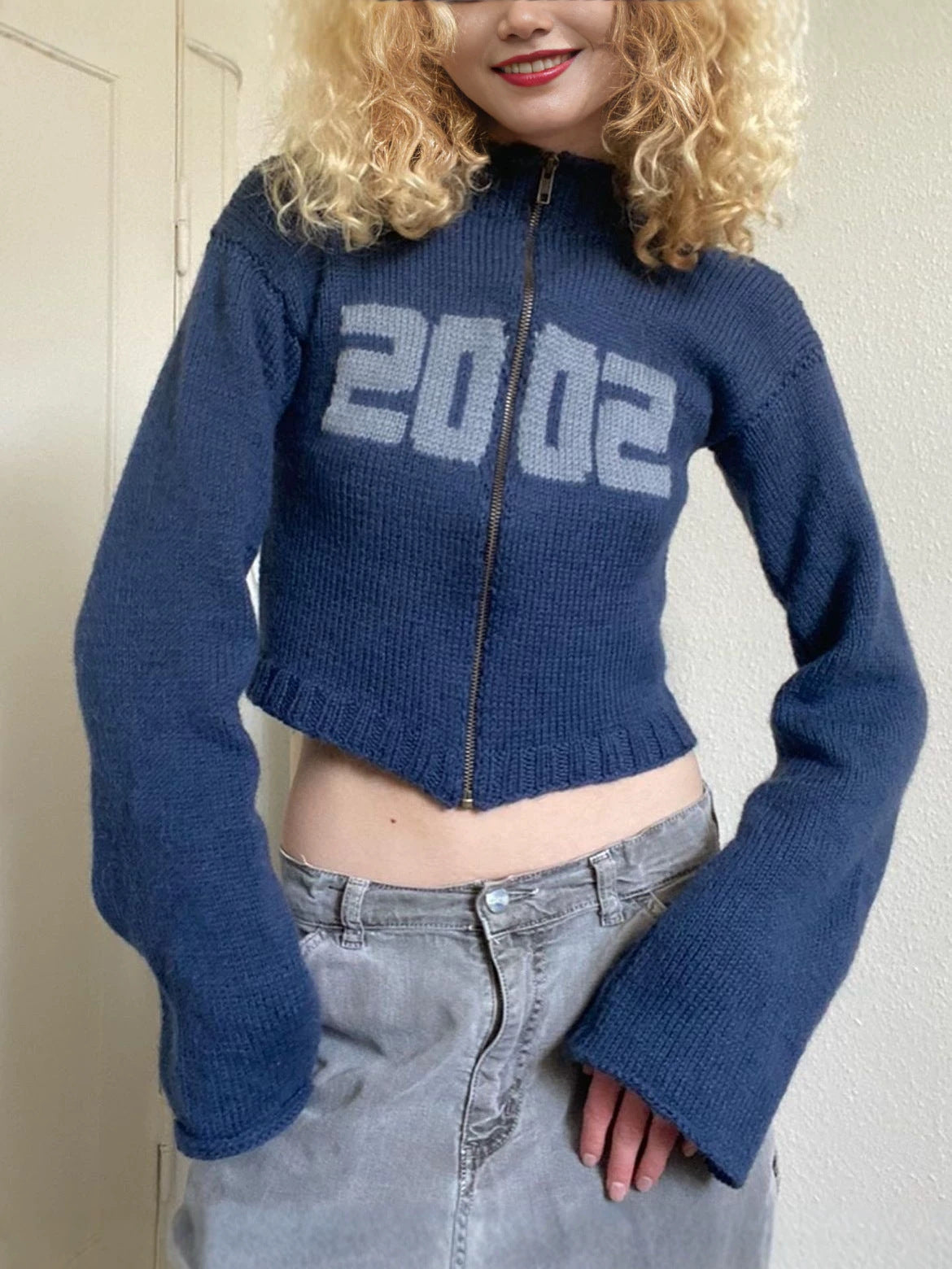 Blue cropped knit sweater with half-high collar, front zipper, 2002 print, long bell sleeves