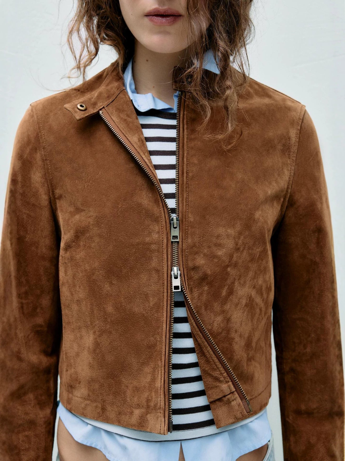 Brown faux suede motorcycle jacket with diagonal zip and snap collar button