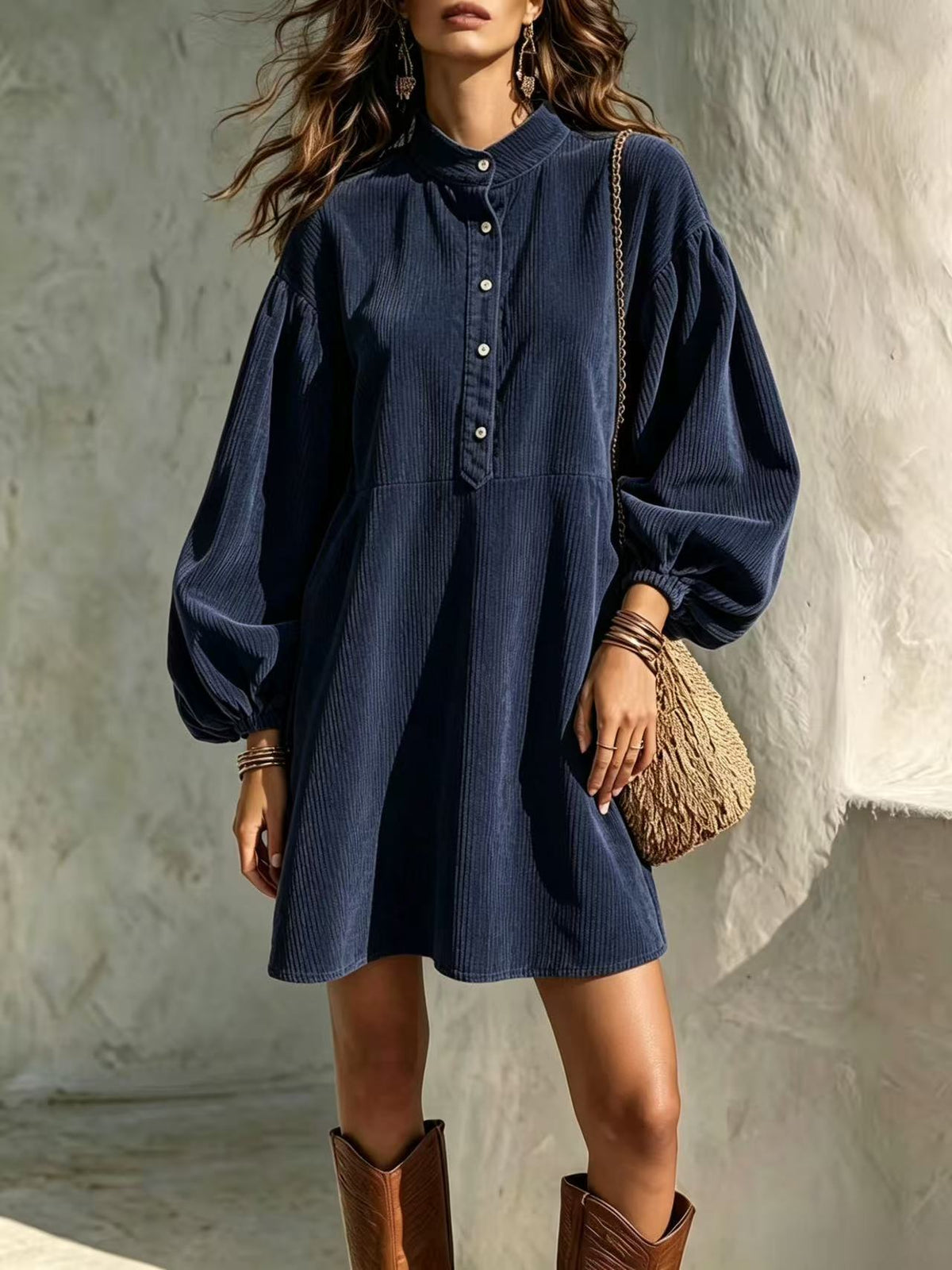 Dark blue corduroy dress with stand-up collar, button-front, and lantern sleeves