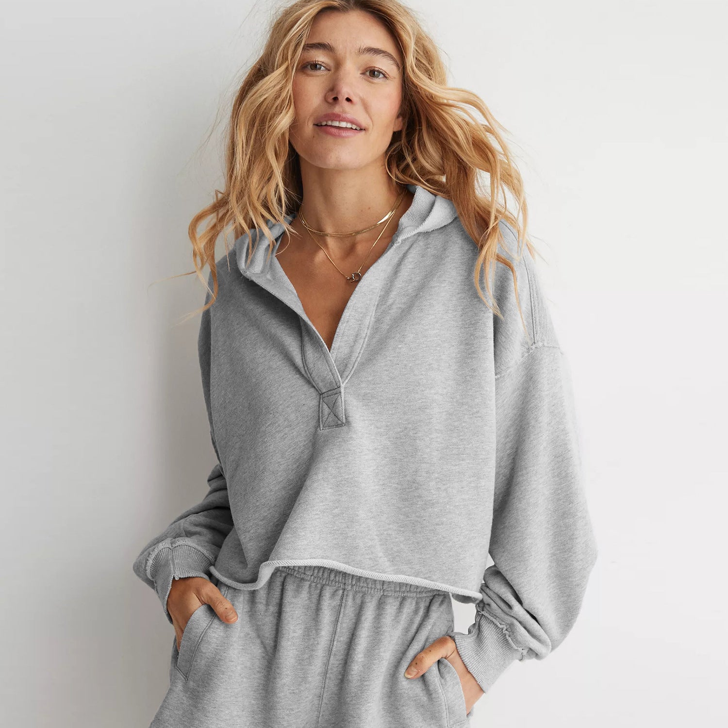 Women's light gray V-neck hooded pullover sweatshirt, long sleeves, drawcord hood