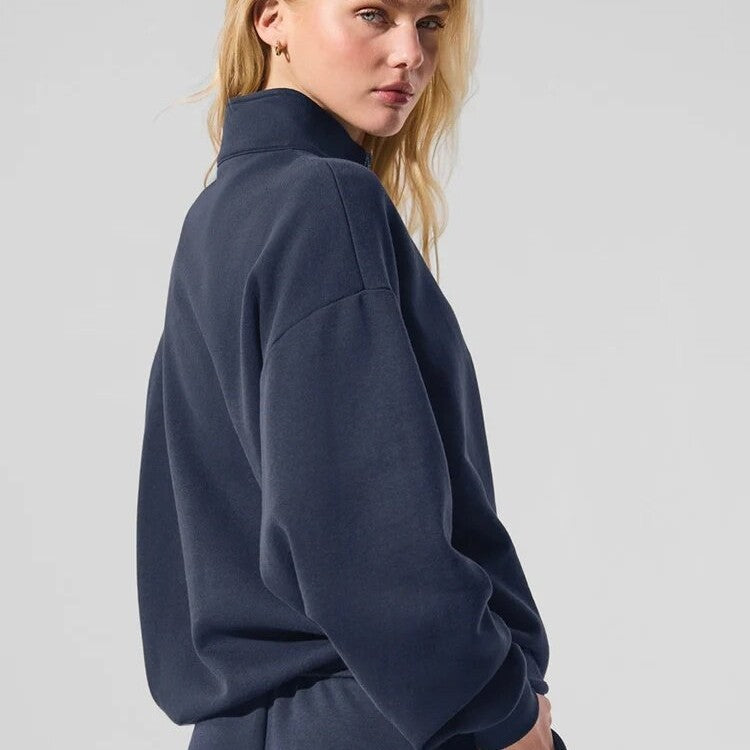 Navy half-zip pullover sweatshirt with stand collar, long sleeves, side profile