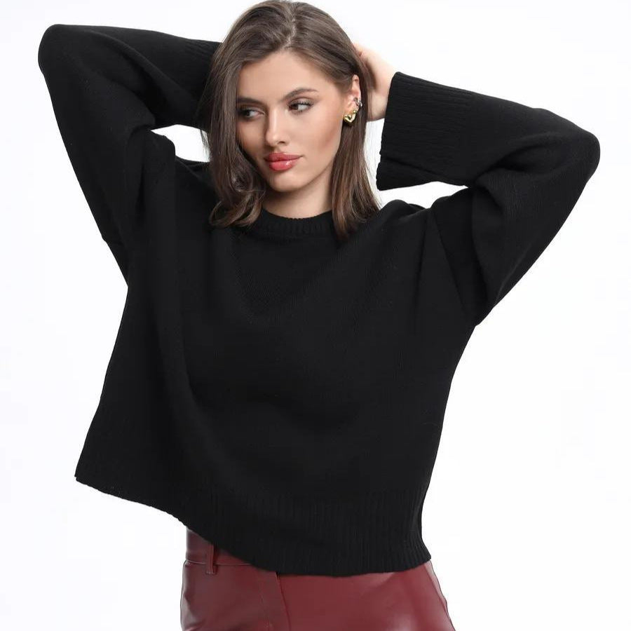 Black oversized mock neck drop-shoulder sweater with ribbed cuffs and hem