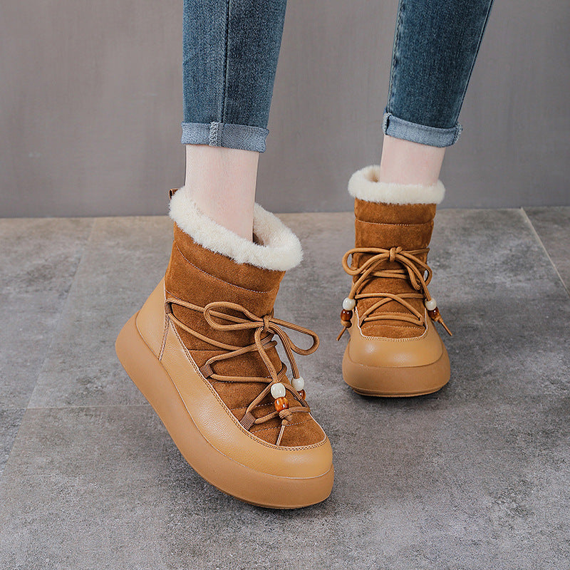 Brown lace-up winter snow boots with thick sole and shearling-style top trim