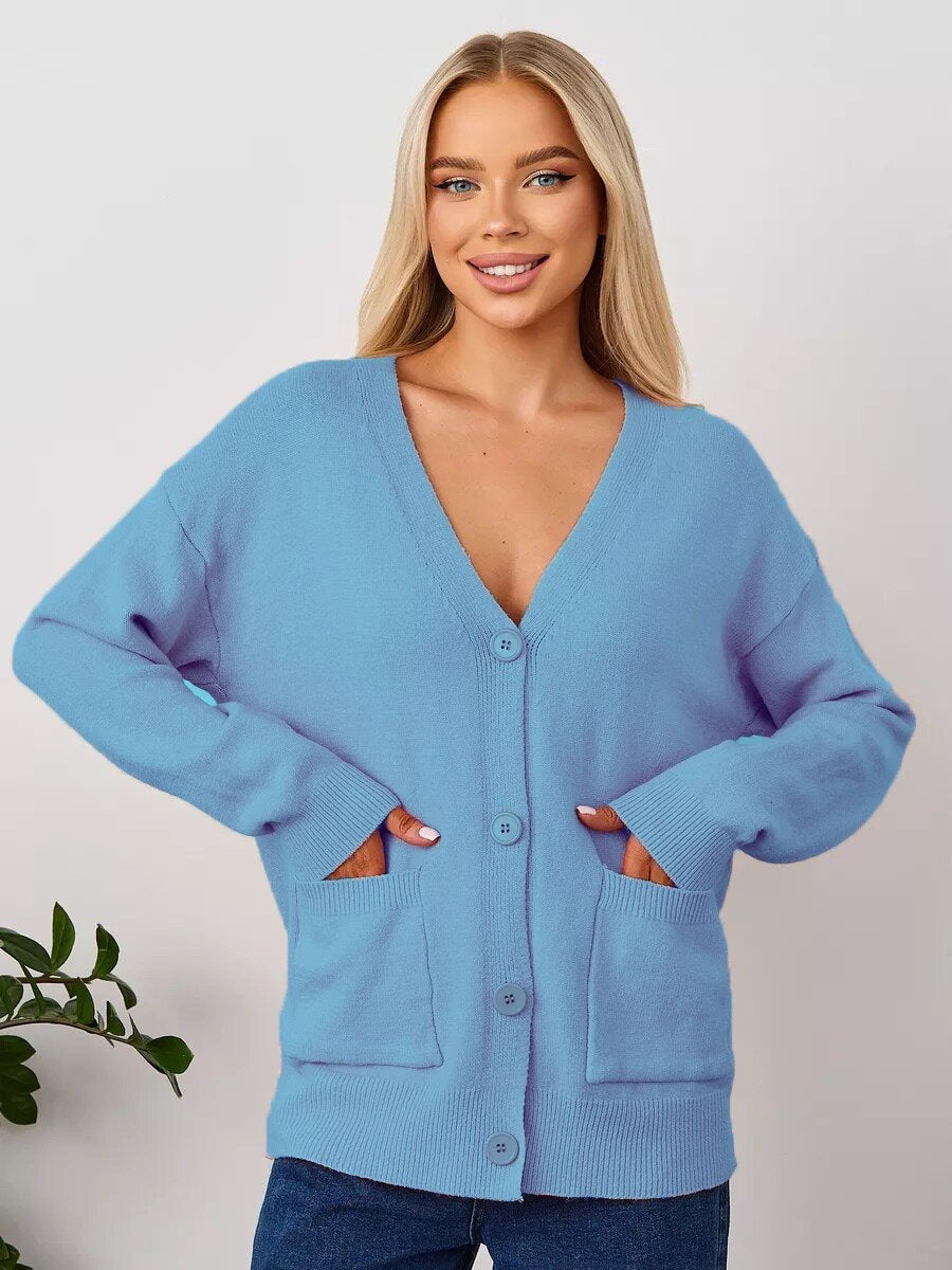 Women's blue knit V-neck cardigan with button front and front pockets, long sleeves