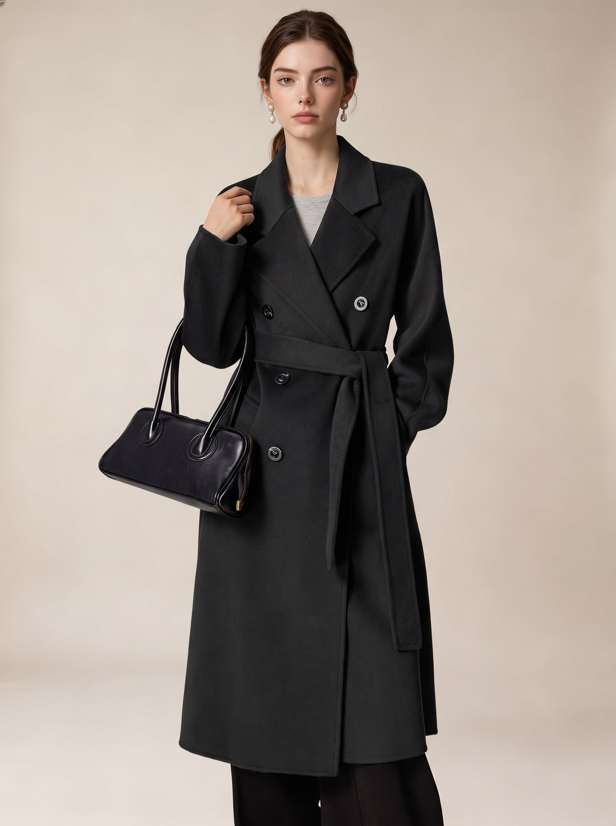 Long black belted double-breasted wool coat with wide lapels