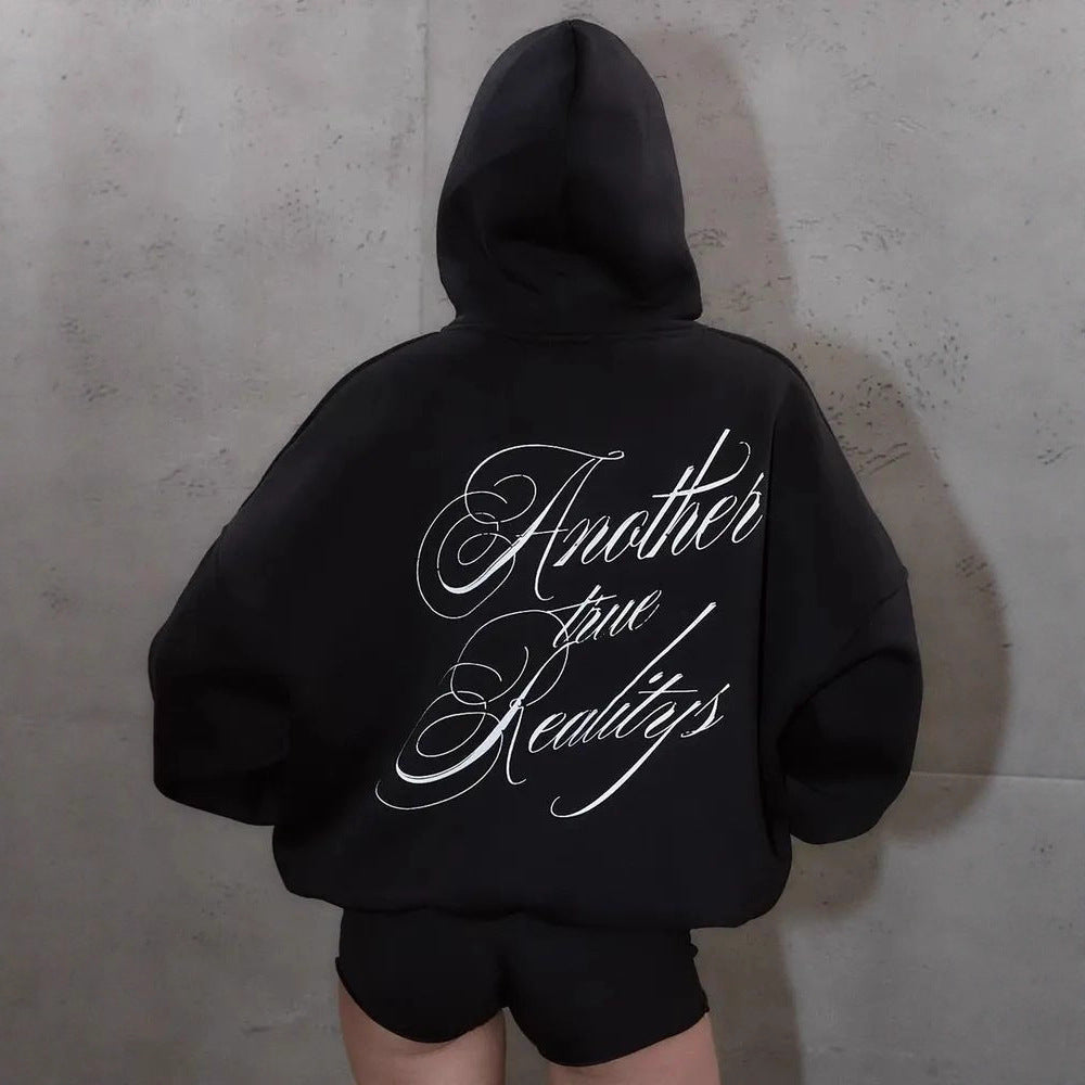 Black women's pullover hoodie featuring bold white lettering across the back