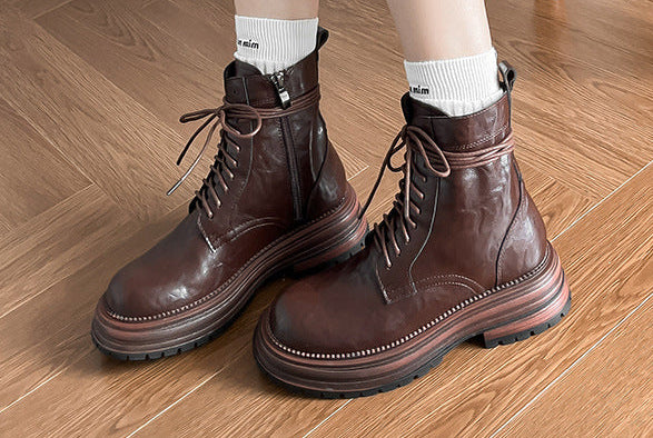 Brown lace-up ankle combat boots, side view, with thick platform sole