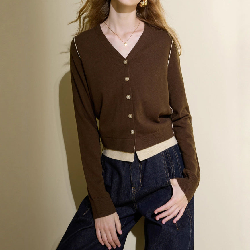 Brown V-neck knit cardigan with button front and cream contrast hem band