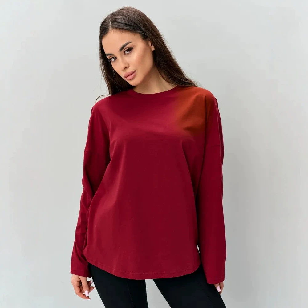 Wine red long-sleeve cotton top with a round neck and relaxed fit