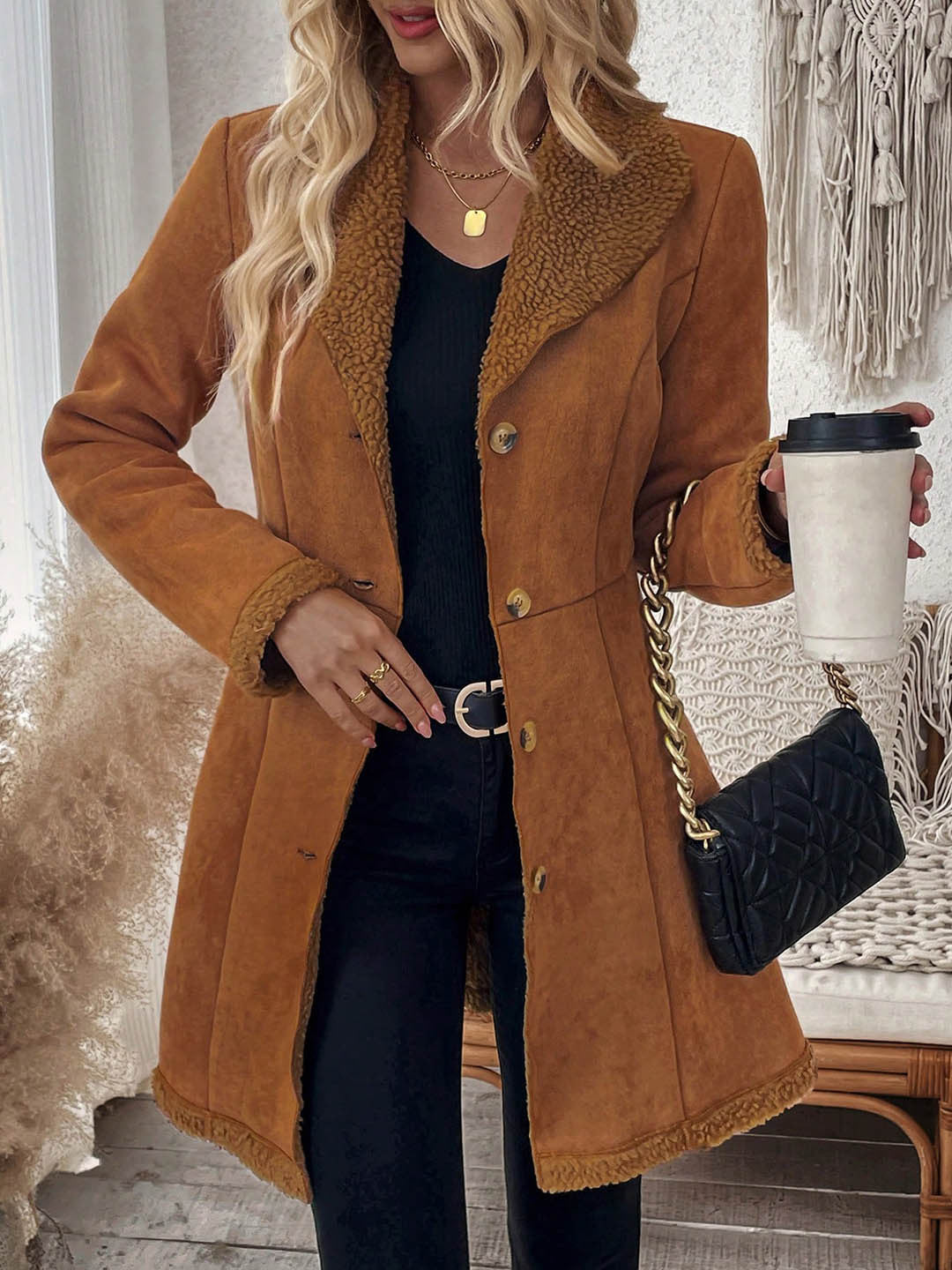 Mid-length brown suede-look jacket with shearling trim and button front.
