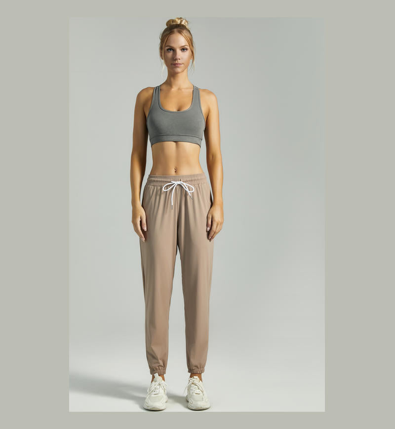 Women's khaki jogger pants with drawstring waist and elastic cuffed ankles