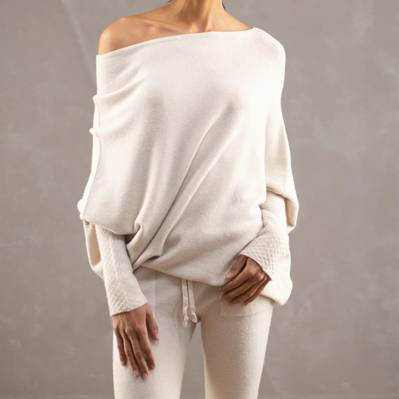 Off-white off-shoulder pullover sweater with long sleeves and relaxed drape