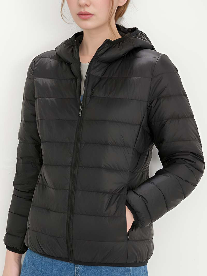 Women's black hooded down jacket, zipped up with horizontal quilting.