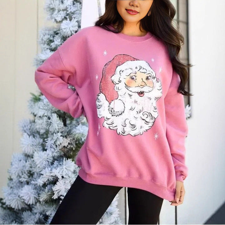 Women’s pink sweatshirt with long sleeves and Santa face graphic, round crew neck