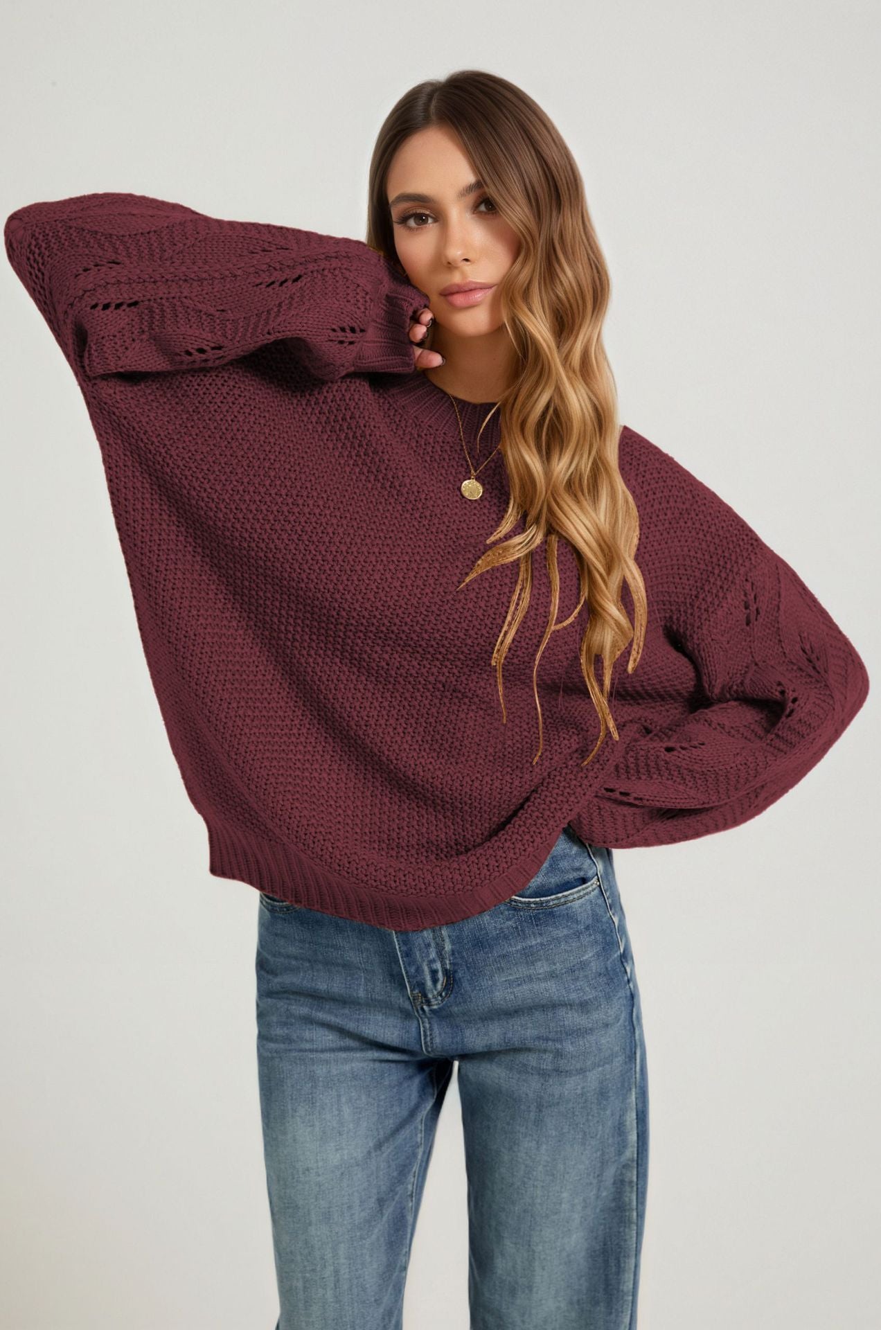 Burgundy open-stitch sweater with crew neckline and ribbed cuffs, front view