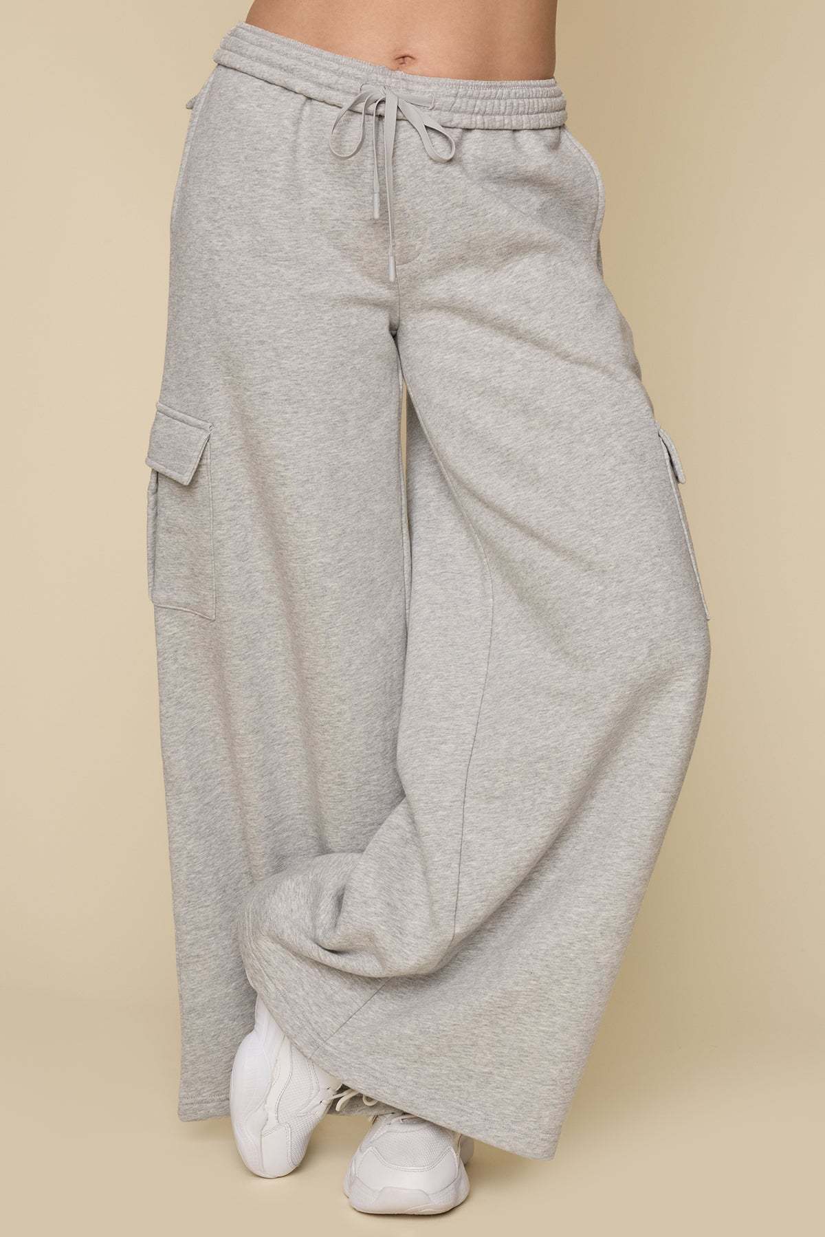 Light gray wide-leg cargo pants with elastic drawstring waist and side pockets