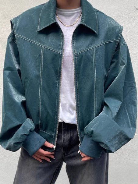 Dark green faux leather moto jacket with contrast seams, zip front, oversized cropped look