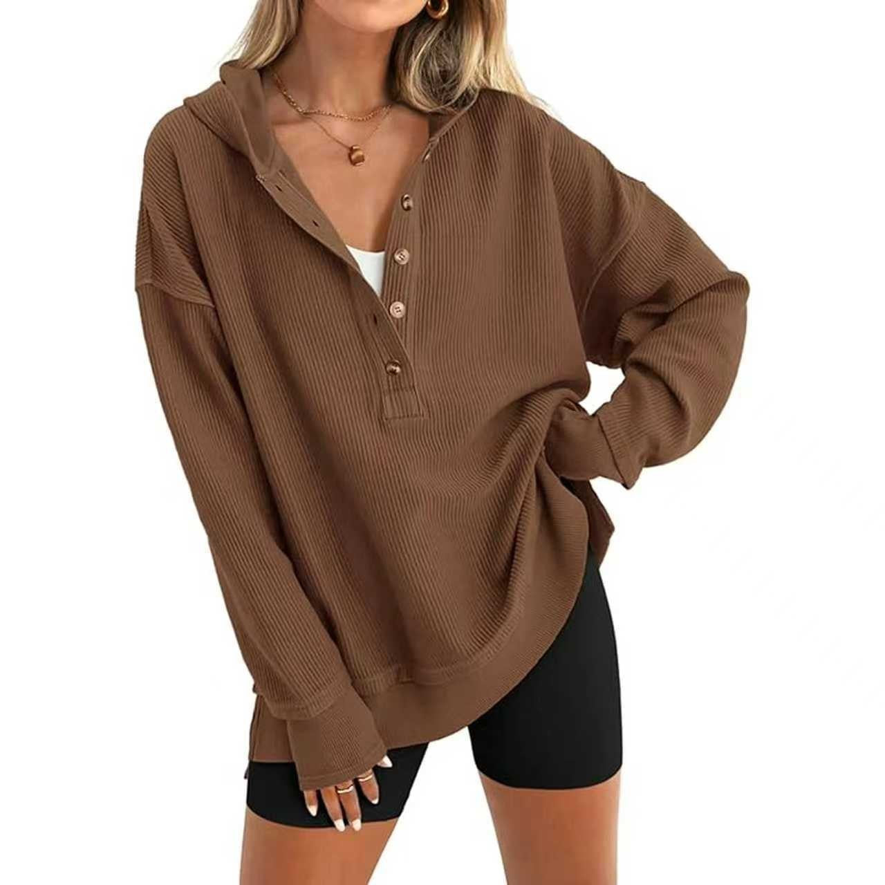 Brown hooded henley sweatshirt detail: button placket and ribbed cuffs