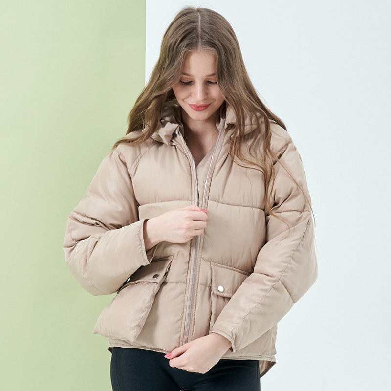 Women’s hooded puffer coat in tan with zip front and snap flap pockets