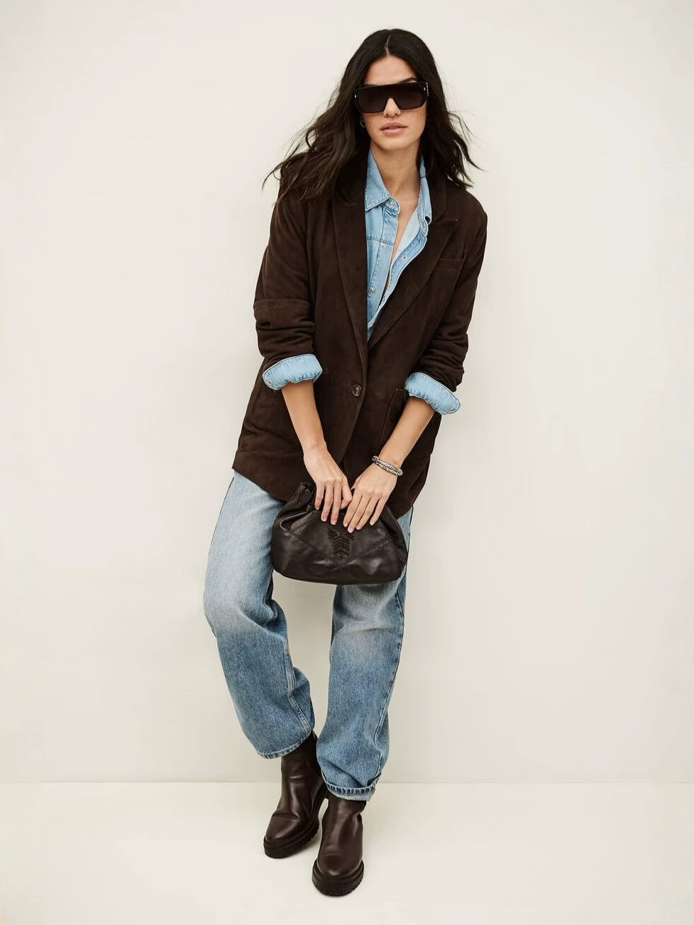 Loose dark brown suede blazer with one-button closure and rolled cuffs