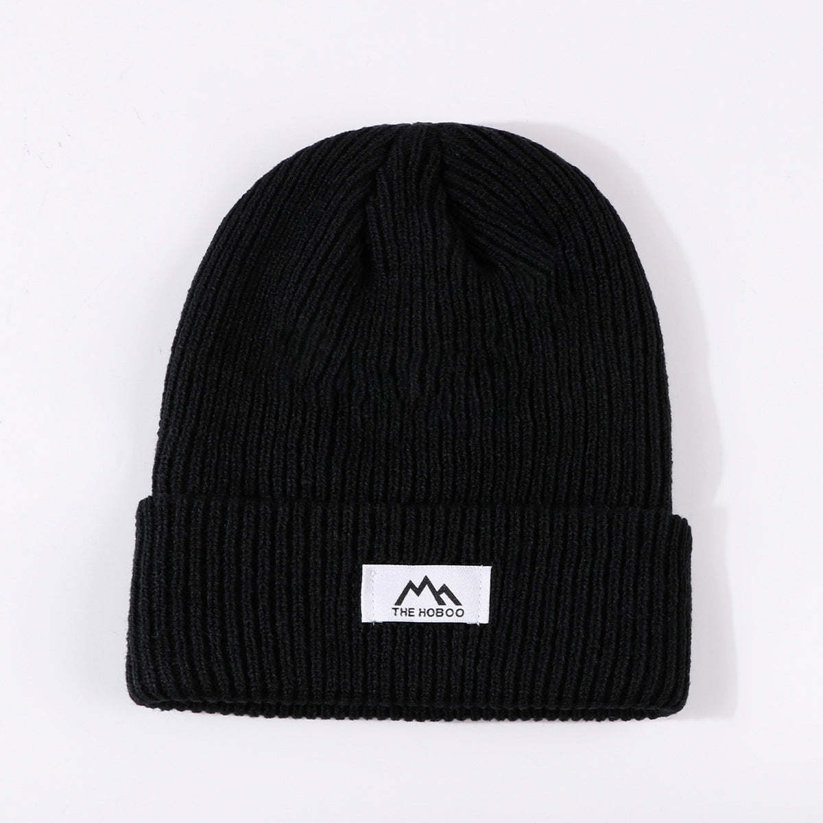 Black knit beanie with fold-up cuff and THE HOBOO logo patch