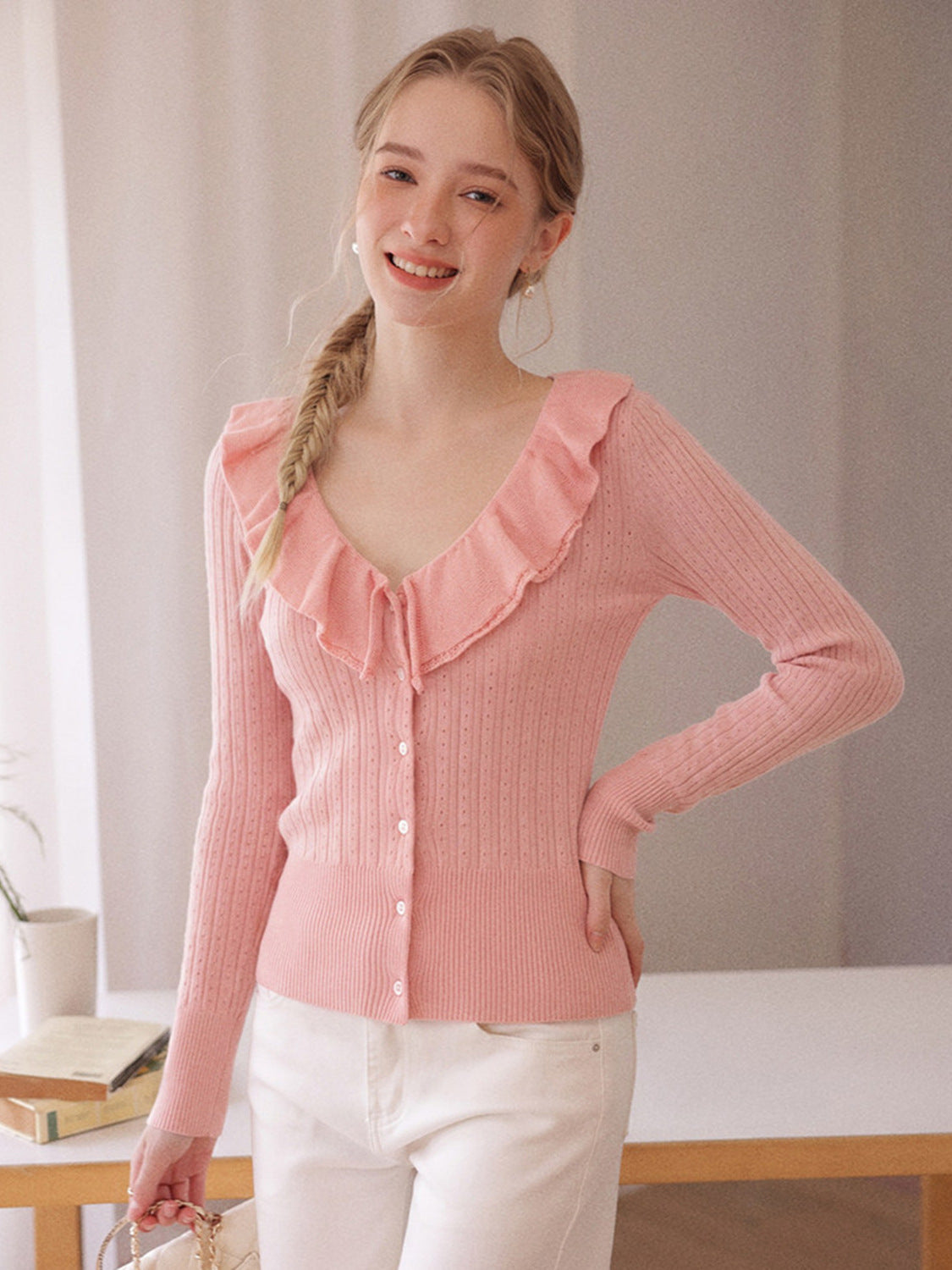Pink long-sleeve knit V-neck button top with ruffled collar