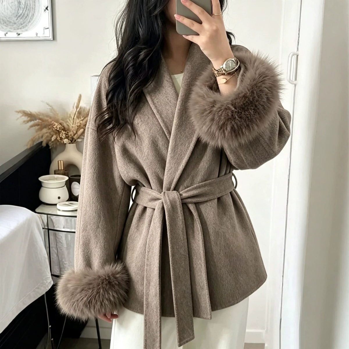 Taupe wool wrap coat with turn-down collar, tie belt, and faux fur sleeve cuffs.