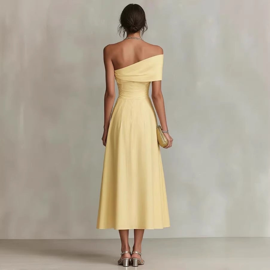 Yellow one-shoulder backless midi dress, cinched waist, pleated skirt