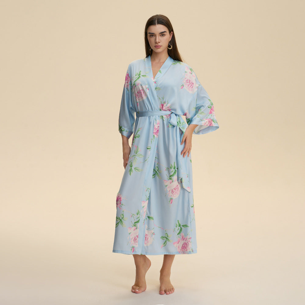 Light blue satin robe with floral print, tie waist, elbow-length kimono sleeves, V-neck