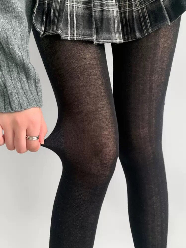 Matte sheer dark pantyhose with smooth leg texture and semi-transparent finish