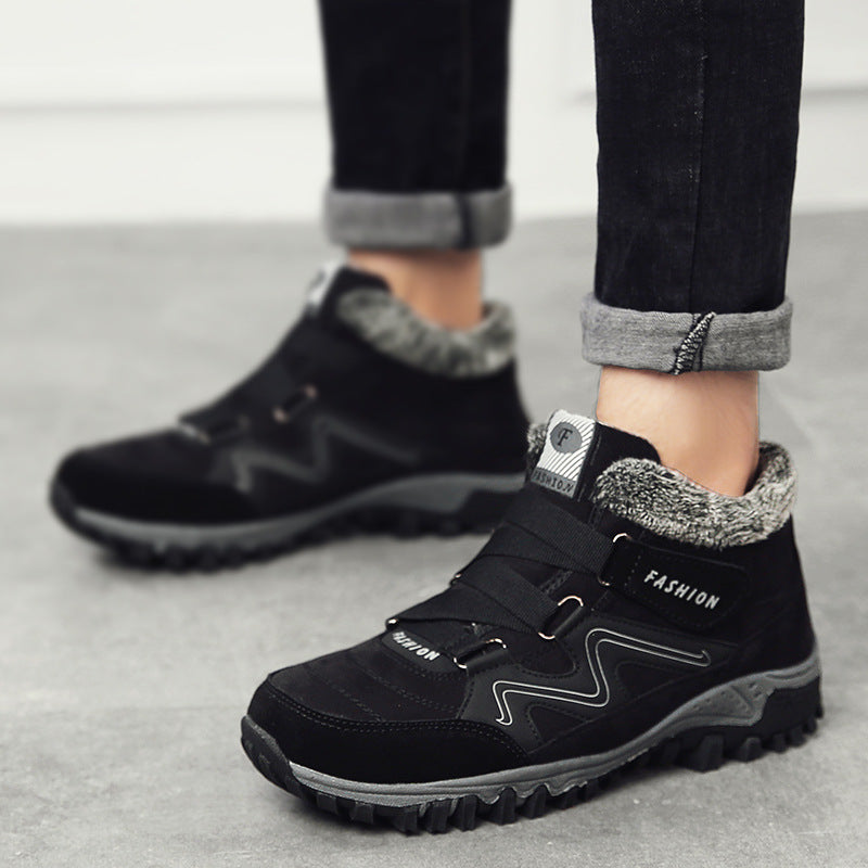 Black winter snow boots with fuzzy cuff, hook-and-loop closure, and rugged tread