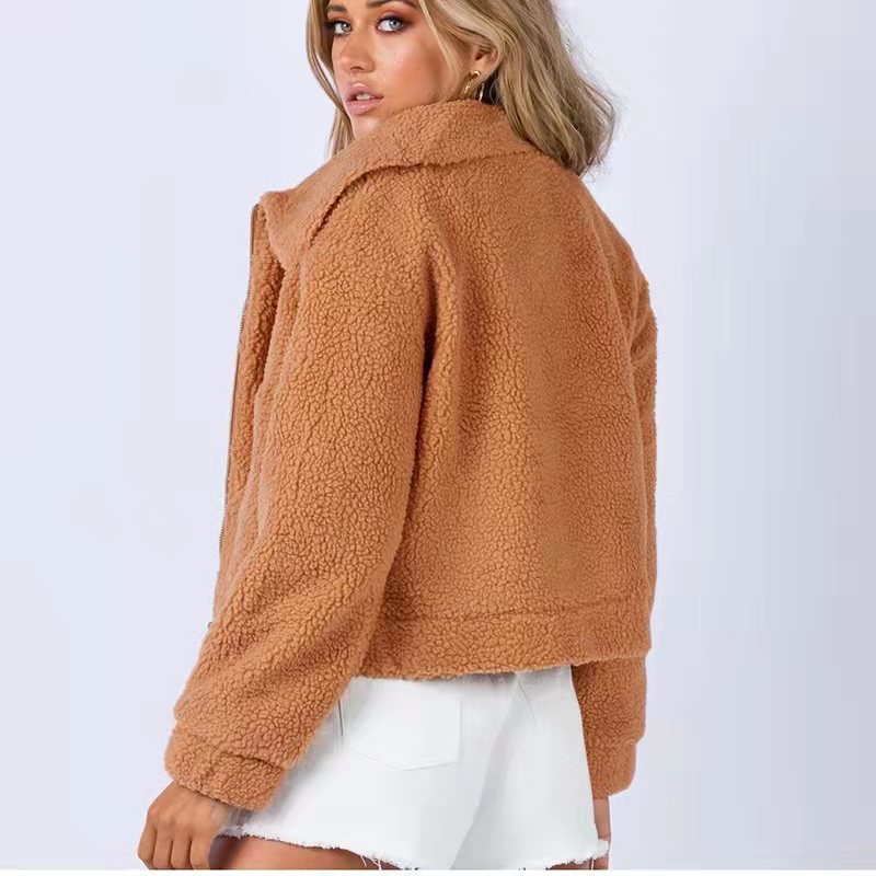 Back view of a rust-colored cropped fleece jacket with long sleeves