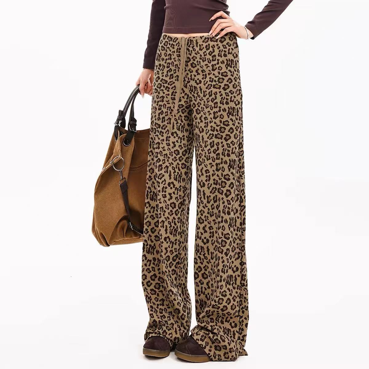 Leopard-print wide-leg leggings, tan/cream with dark spots; relaxed fit with drawstring.