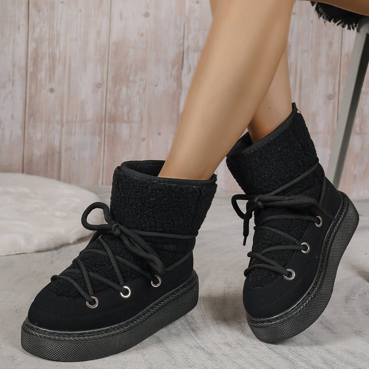 Black fleece-lined lace-up snow boots with thick rubber sole and ankle cuff