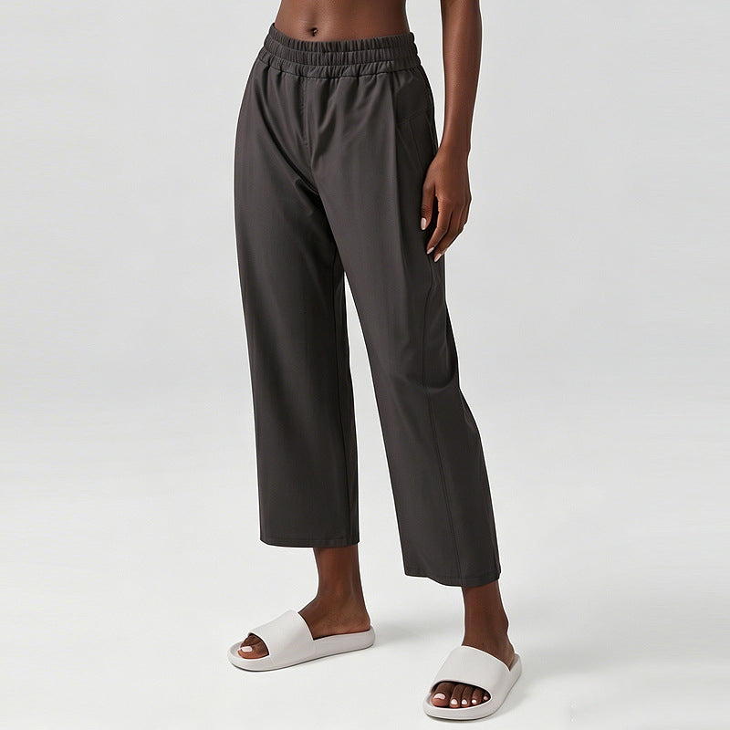 Women’s wide-leg sweatpants with elastic waistband, gray fabric, side pocket on leg.