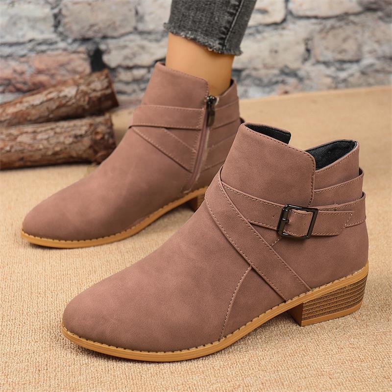 Taupe suede Chelsea ankle boots with side zipper, buckle strap, and block heel.