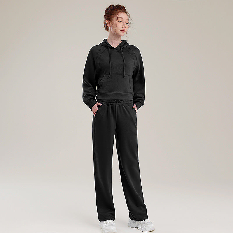 Black hooded sweatshirt and matching sweatpants set with drawstring hood and elastic waist
