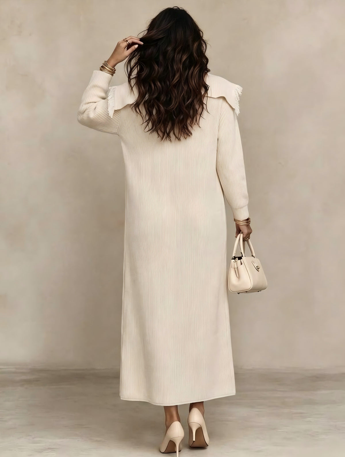 Back view cream tassel-trim cardigan with shawl collar and long sleeves
