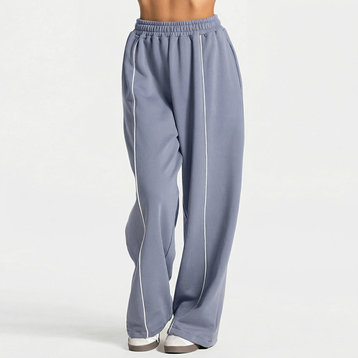 Gray-blue loose yoga pants with elastic waistband and vertical white contrast stripe