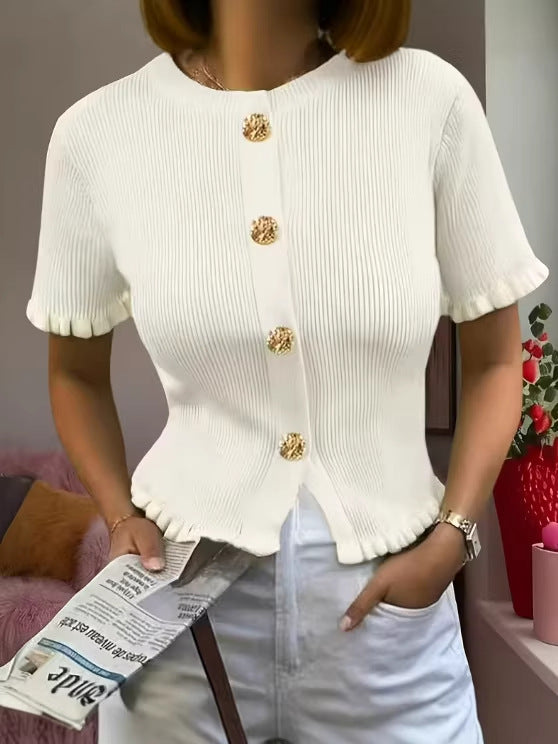 White knit cardigan with vertical gold buttons and short ruffle cuffs