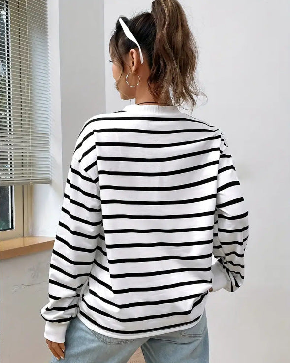 Women's striped sweatshirt back view with black and white horizontal stripes, ribbed cuffs