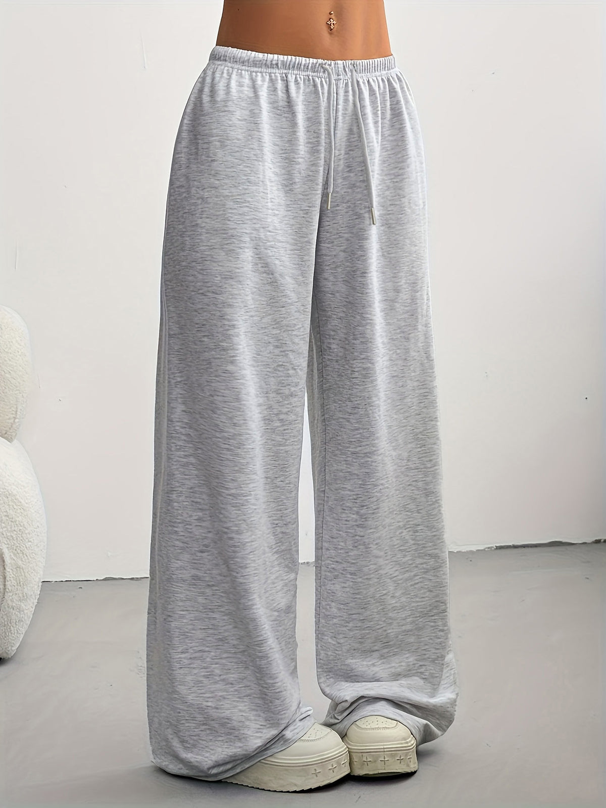 Women's high-waisted wide-leg sweatpants in light gray, full length with elastic waist.