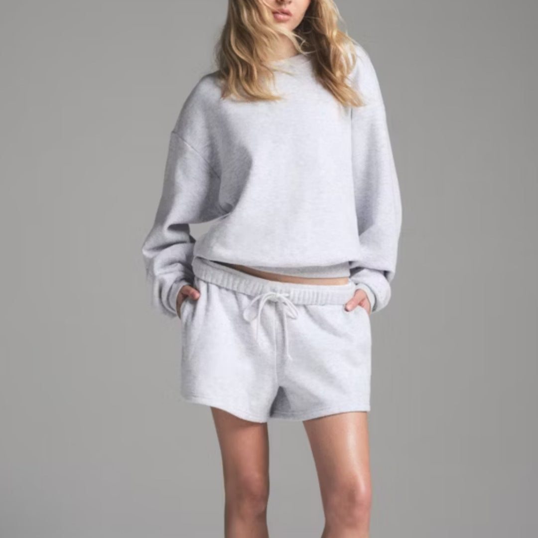 Women’s light gray sweatshirt and shorts set, round neck long sleeves with elastic drawstring.