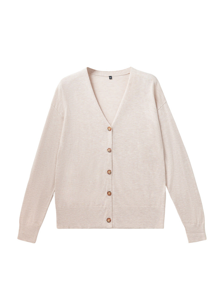 Women’s light beige V-neck cardigan sweater with long sleeves and button-front knit.