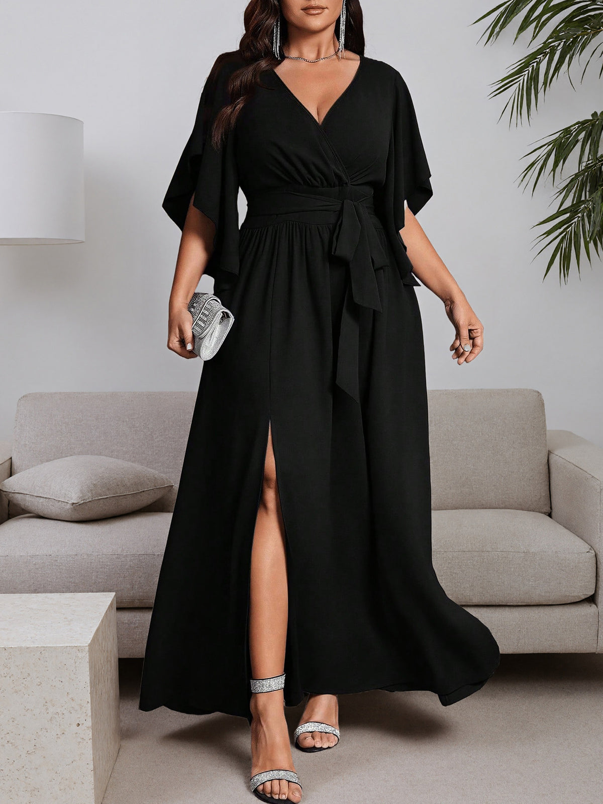 Black plus-size maxi dress with V-neck, tie waist, side slit, flutter short sleeves