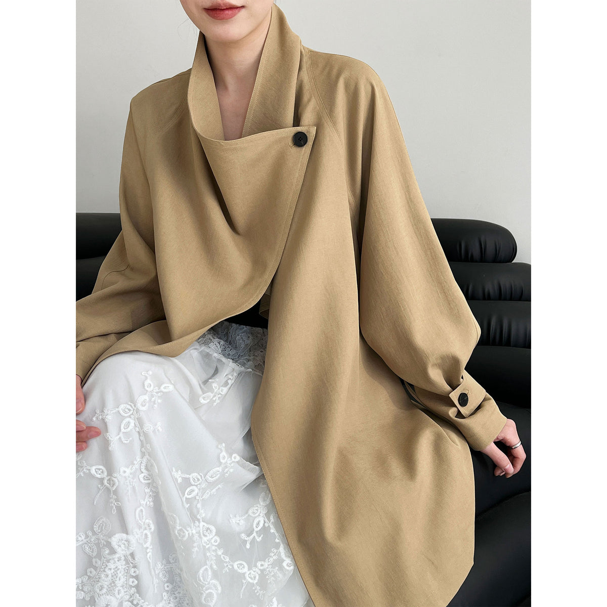 Women’s tan wrap coat with oversized collar and buttoned sleeve cuffs