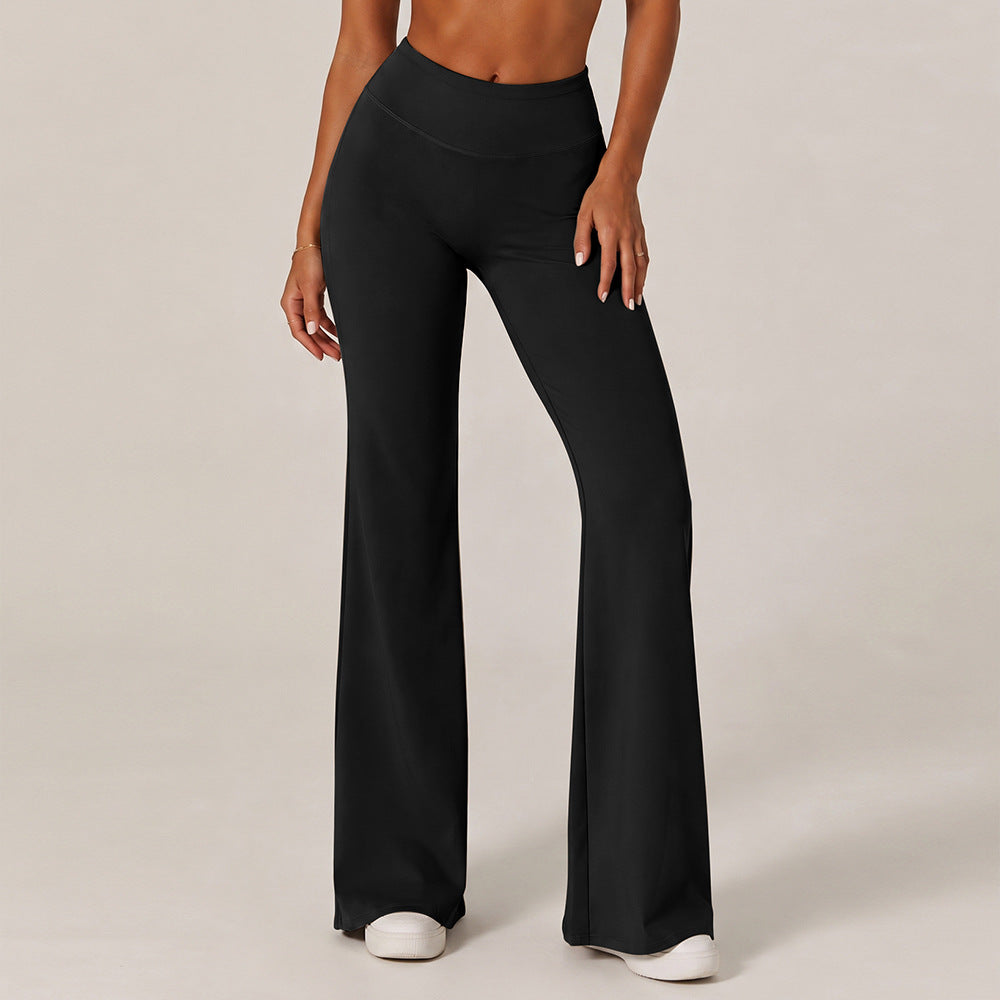 Black high-waisted wide-leg yoga pants with straight cut and wide flared hem